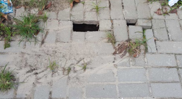 Foto inserida no Relatório de Auditoria do TCE-PR mostra falhas no calçamento em via da Ilha dos Valadares, em Paranaguá. Foto: Divulgação TCE-PR